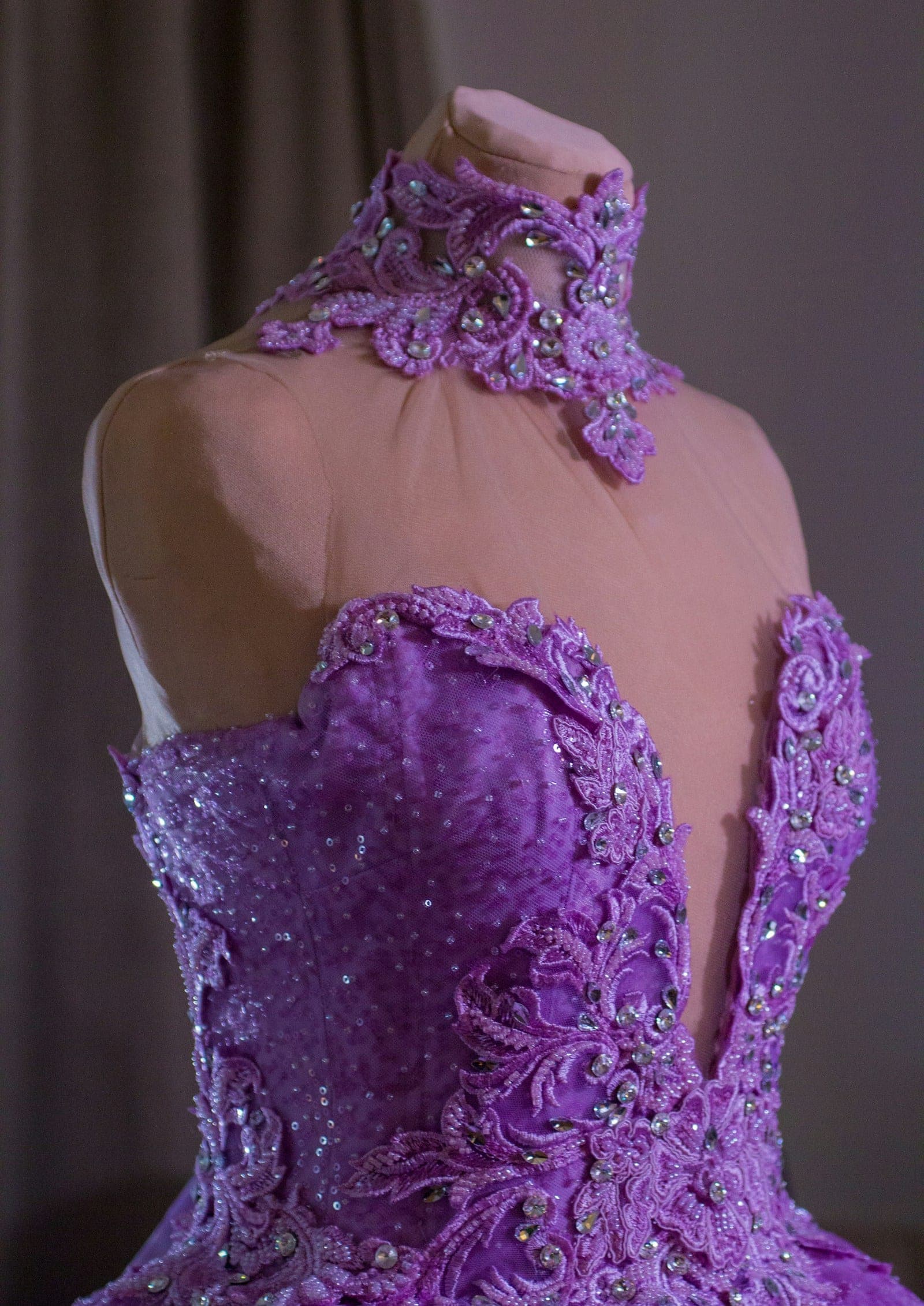 Purple embellished bodice on a dress form