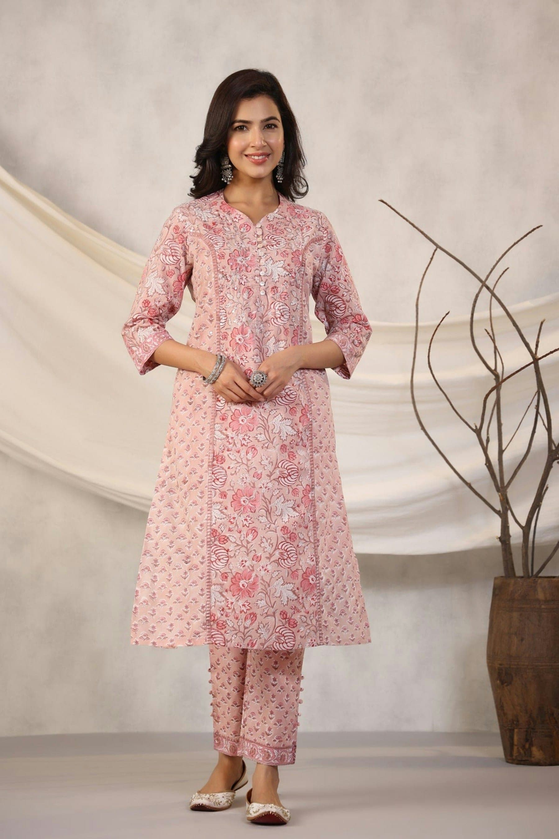 Finished pink printed kurta set worn by a woman